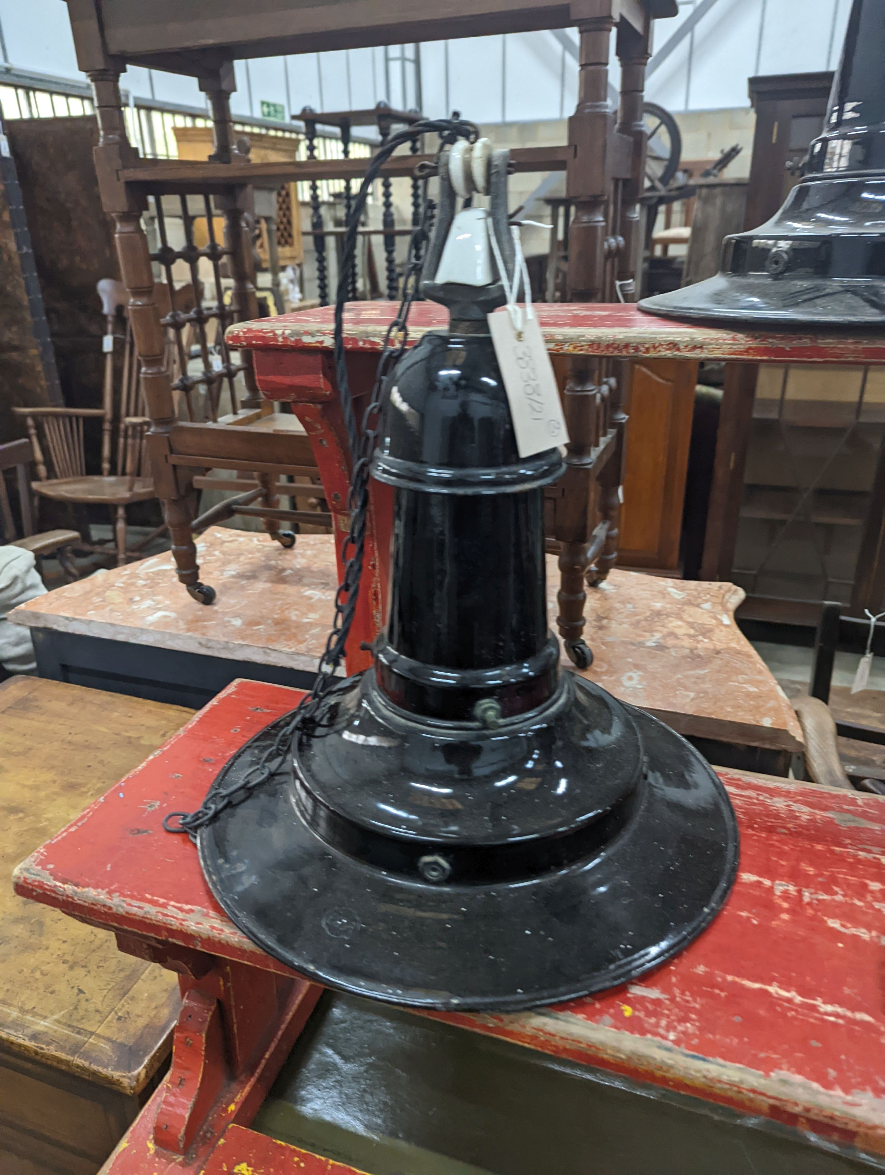 A set of three Continental black enamelled industrial style ceiling shades, height including fittings 39cm